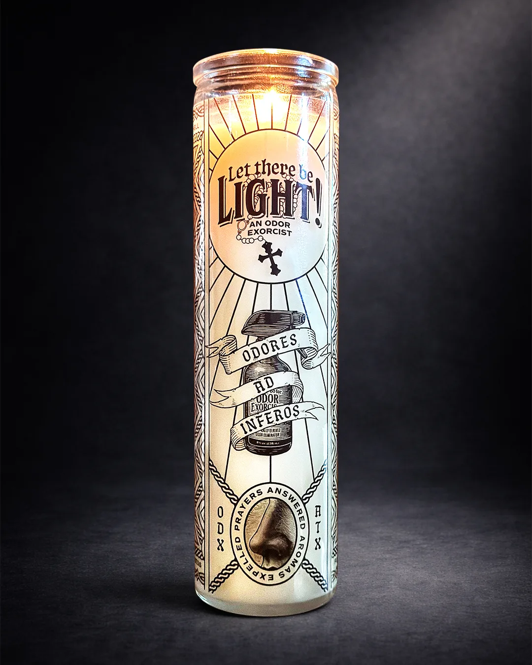 Dramatic, dark-background product photography of a clean/all-natural 12 oz 100% soy wax prayer candle made without fragrance oils.