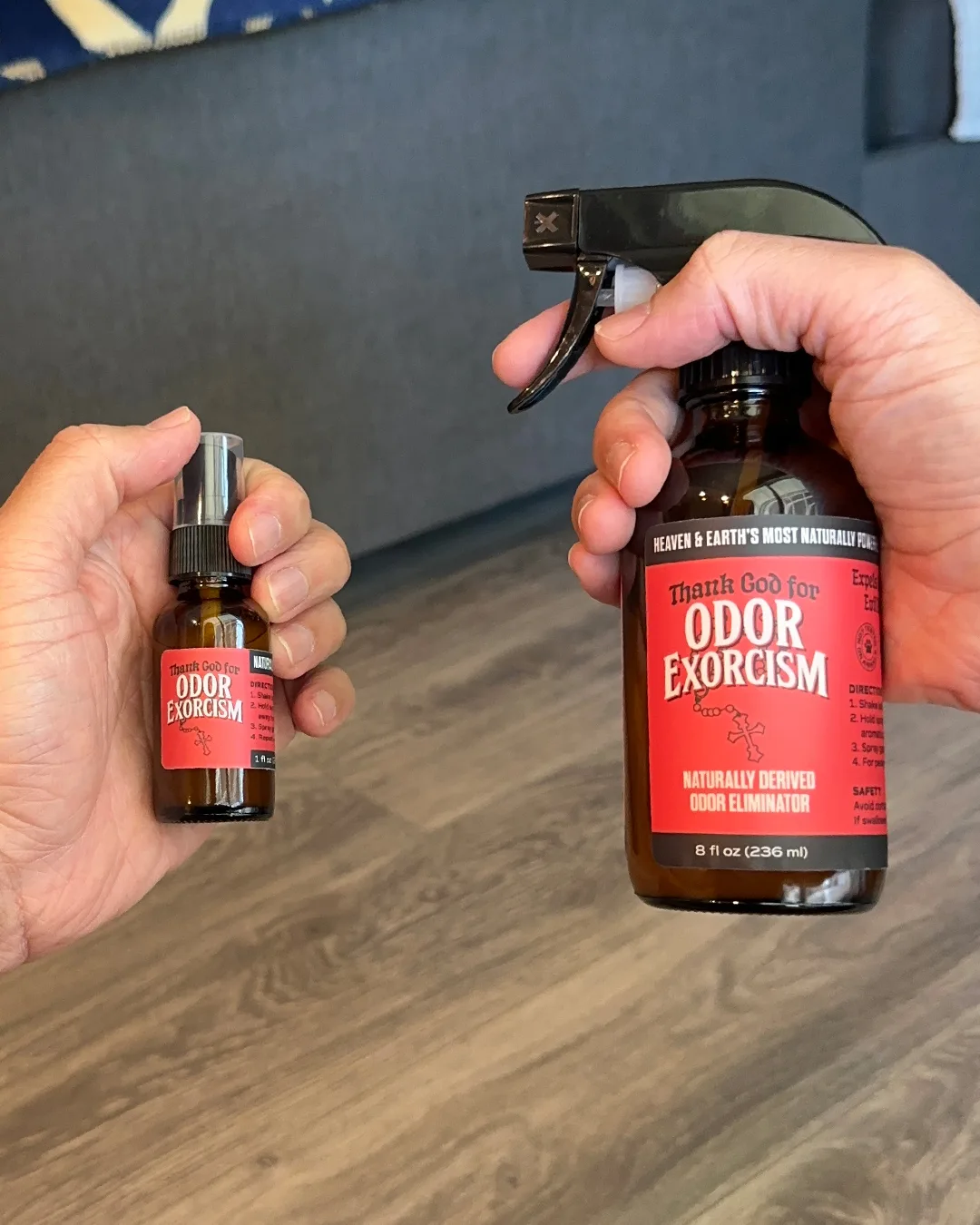 Two sizes of naturally derived odor elimination spray from Odor Exorcism: 8 oz (in right hand) and 1 oz (in left hand).