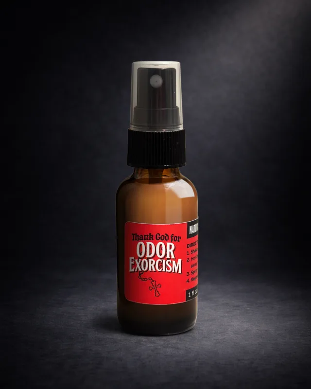 Dramatic, dark-background product photography of Odor Exorcism’s travel-size 1 oz odor eliminator spray bottle.